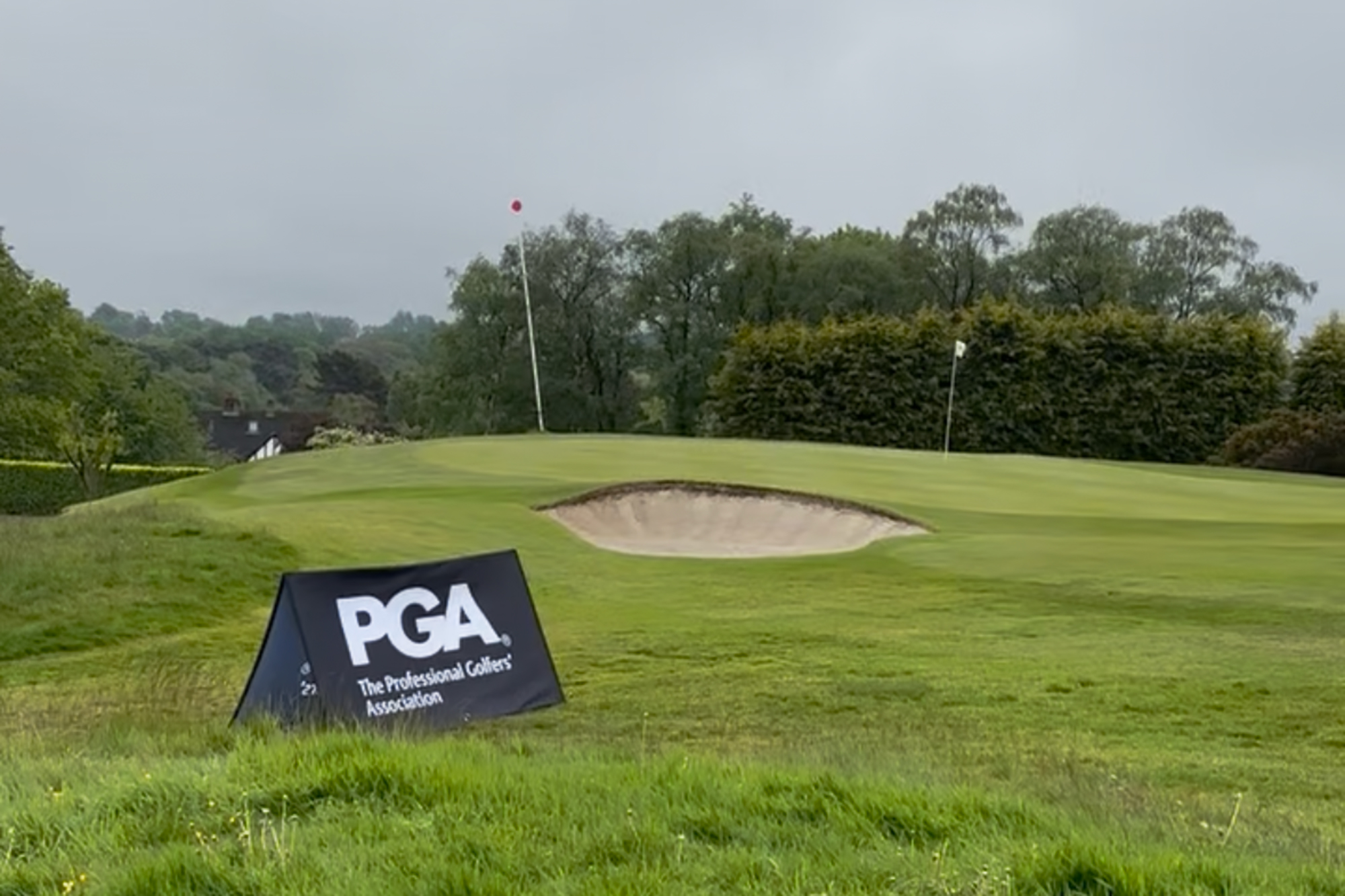 PGA sign near the 18th green at Sand Moor Golf Club for the PGA North tournament 2026