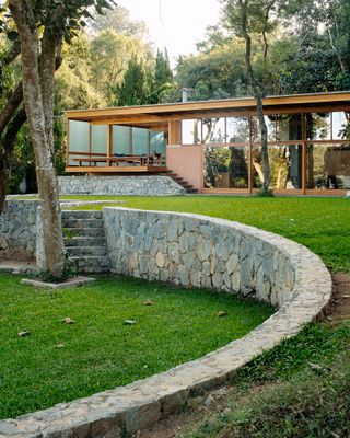 Brazilian garden dwelling seen here with curved garden landscaping