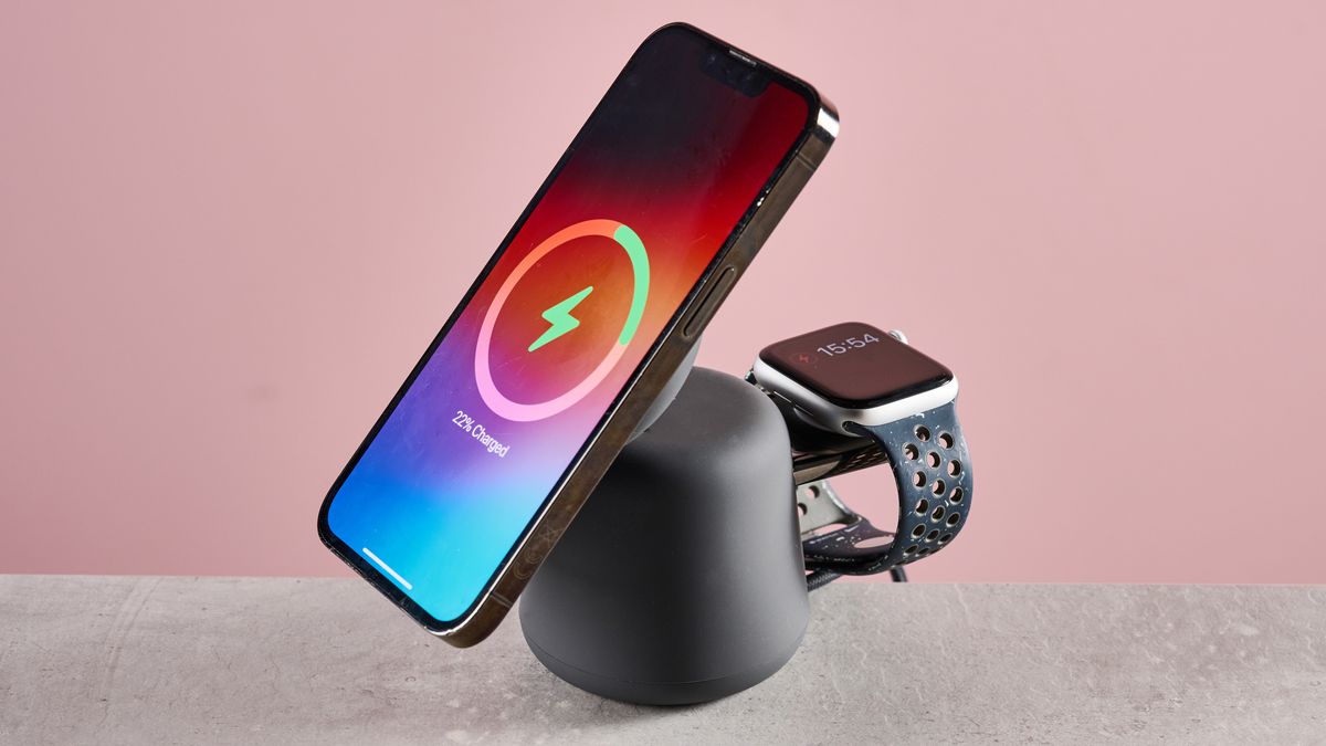 There is an iPhone charging on the 2-in-1 Belkin charger it standing up, and an Apple Watch can be seen charging on the rear charing module.