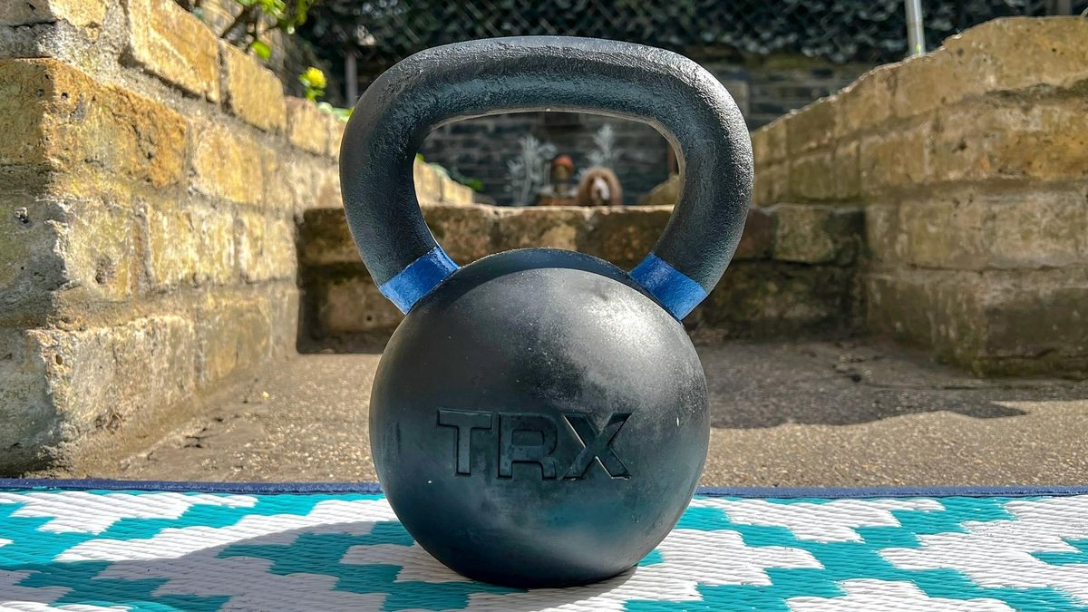 TRX Rubber Coated Kettlebell on a garden floor outside