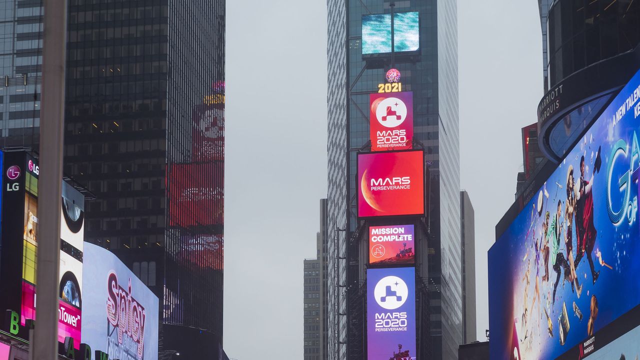 A NASA Mars Rover Landing banner is seen confirming the mission is complete on the One Times Square video board after NASA's Perseverance rover landed on the surface of Mars, Thursday, Feb. 18, 2021 in New York City.