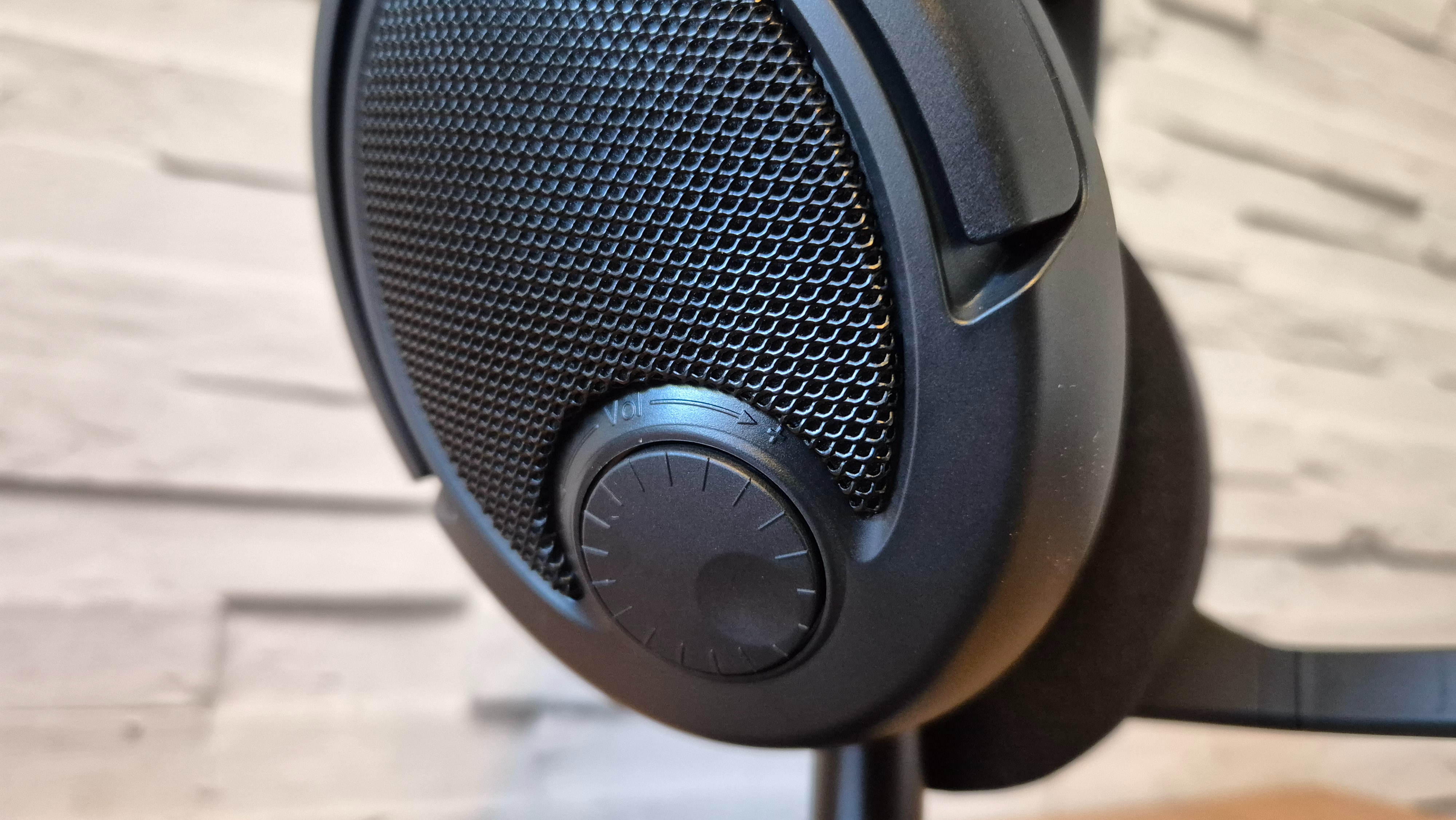 A close up of Drop + Epos PC38X headset showing the volume wheel on its right earcup