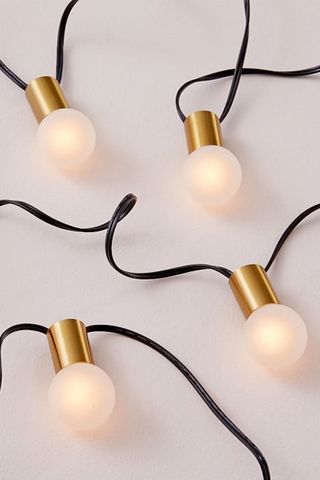 Outdoor string lights from West Elm with gold detail and black cable