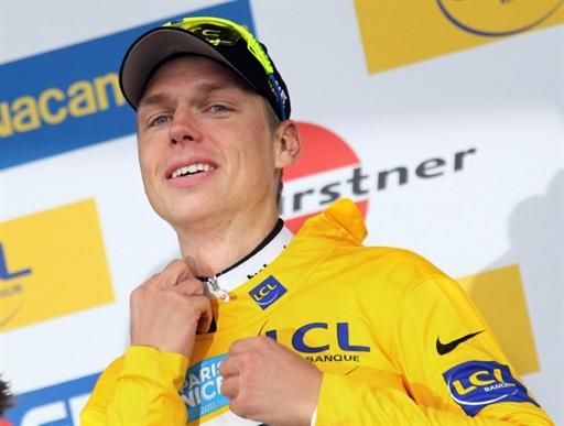 Tony Martin (HTC-Highroad) zips up the overall winner's yellow jersey at Paris-Nice