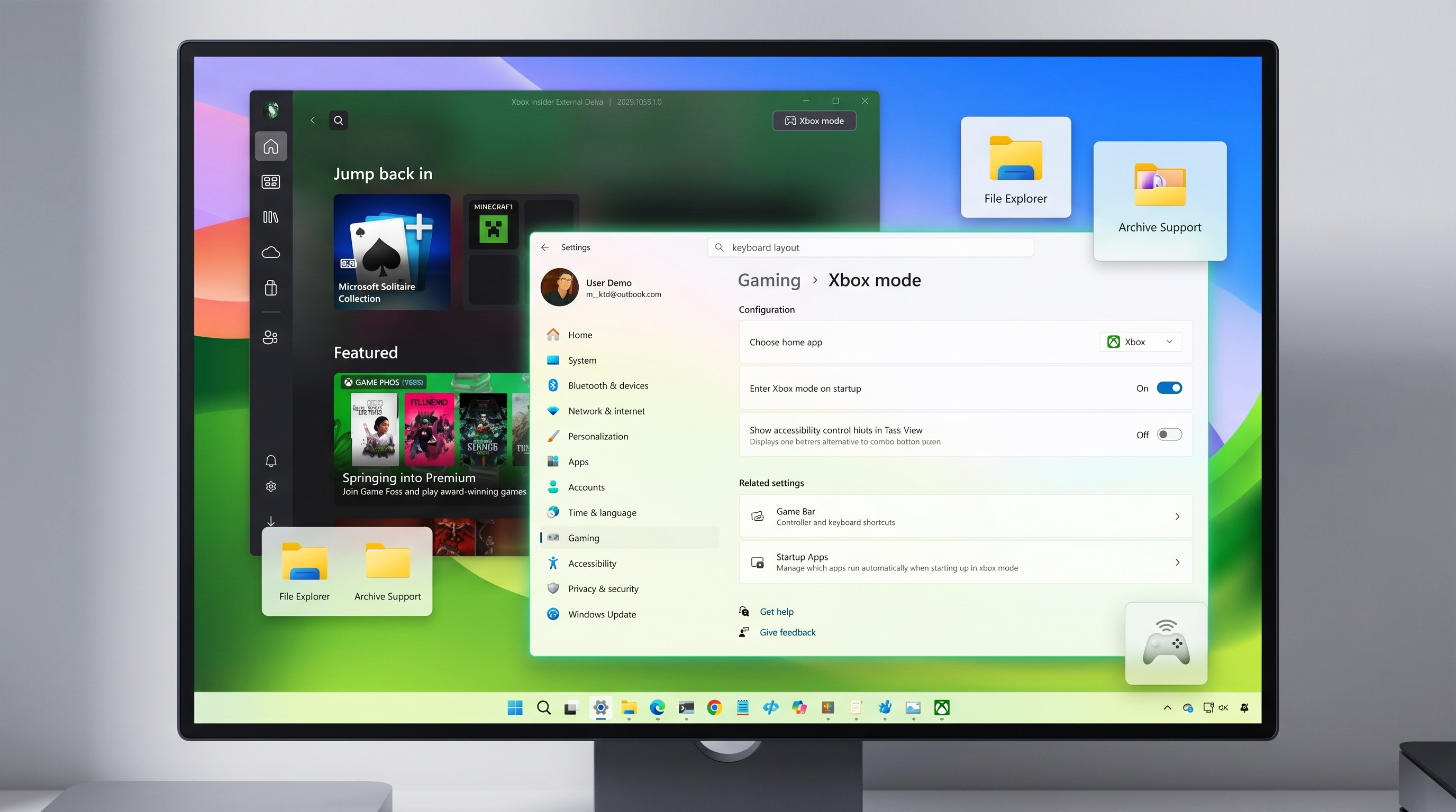 A computer monitor displays a vibrant desktop with open settings for "Xbox mode" under Gaming. File Explorer and Archive Support icons are visible.