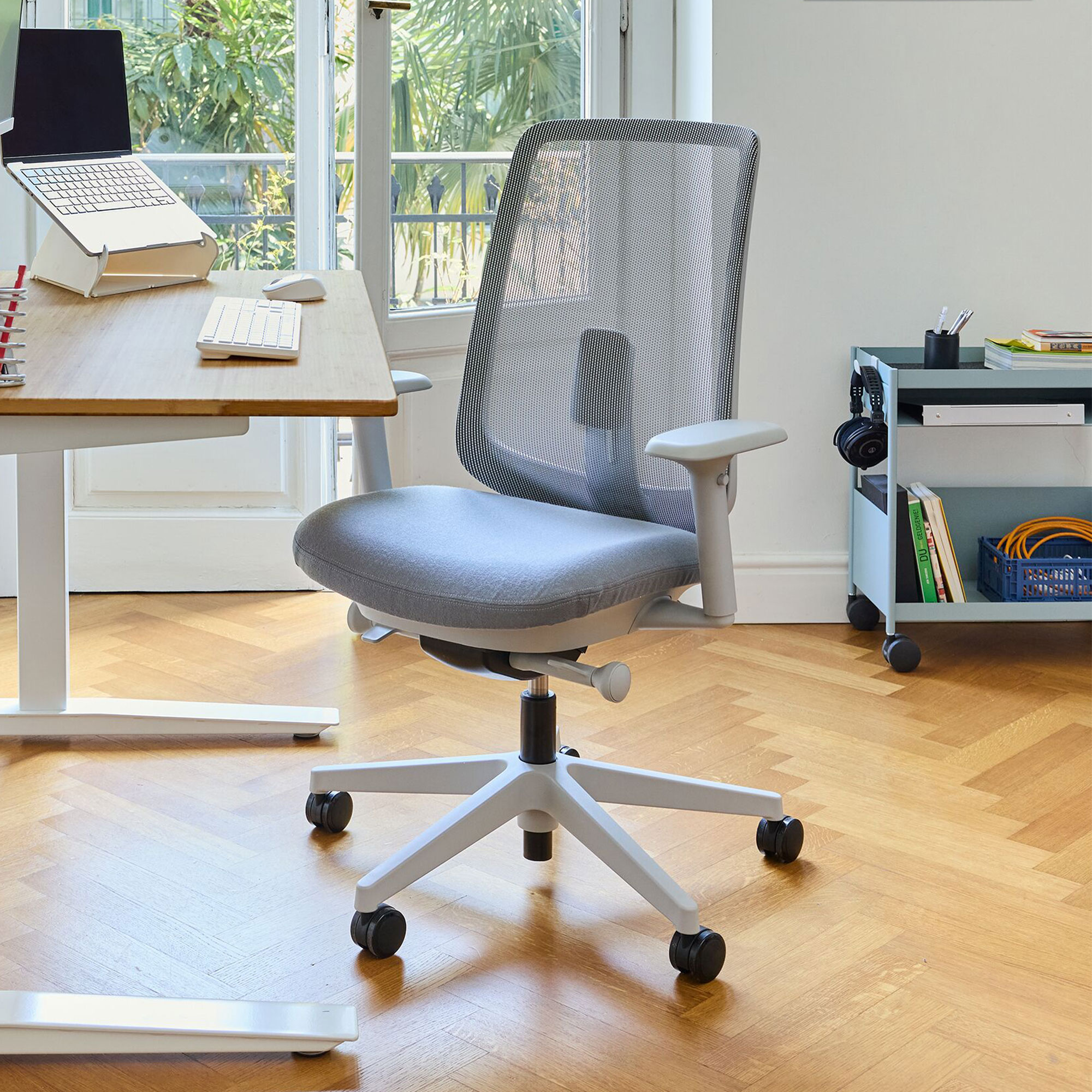 Grey office chair but white and wood desk