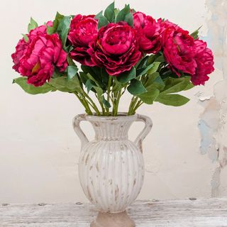 pink faux peonies in a vintage vase