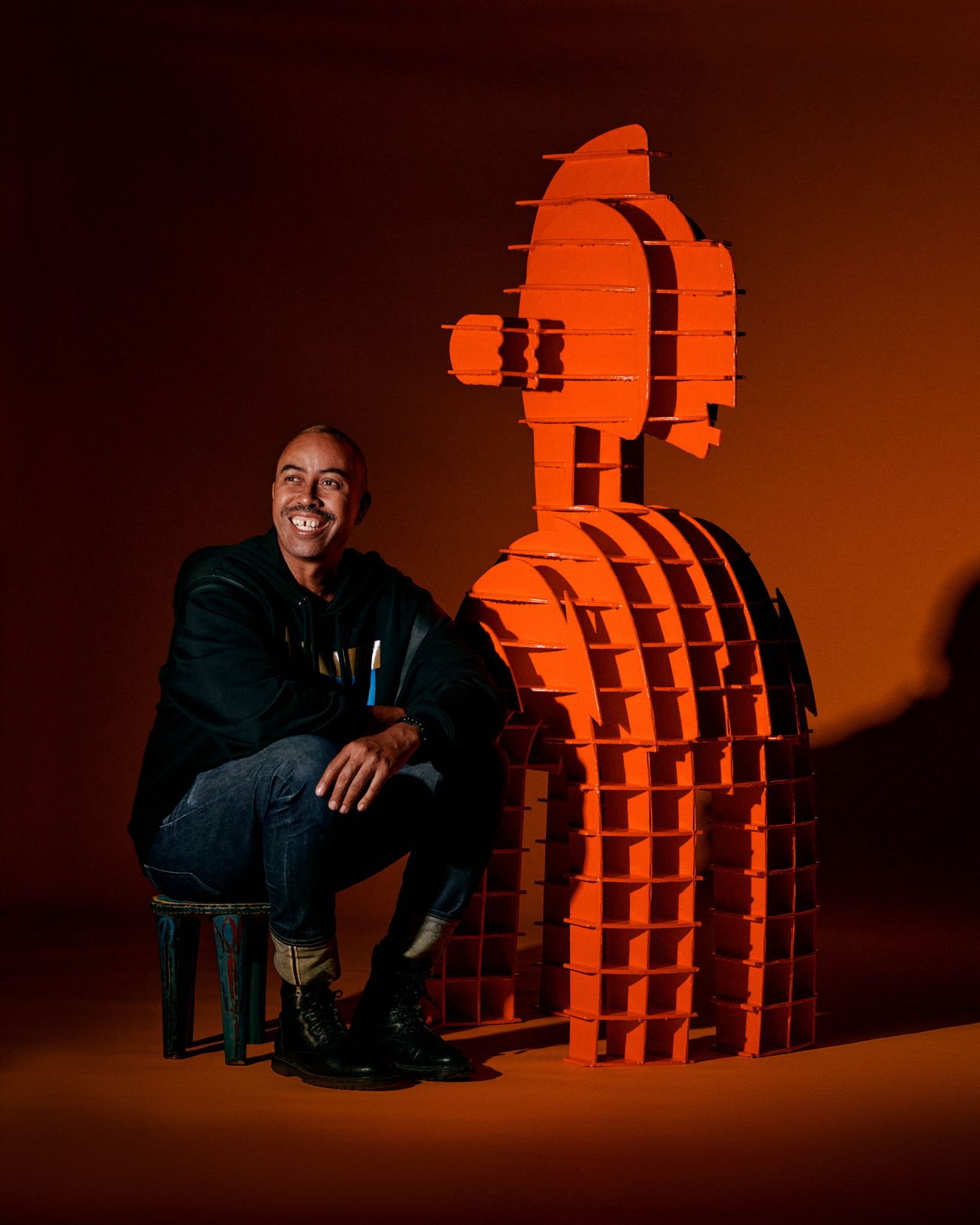 Designer Stephen Burks with The Ancestors sculpture