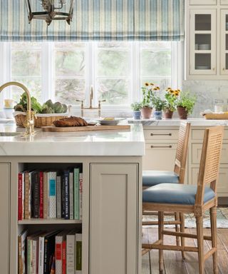 Warm kitchen island with built in bookshelves