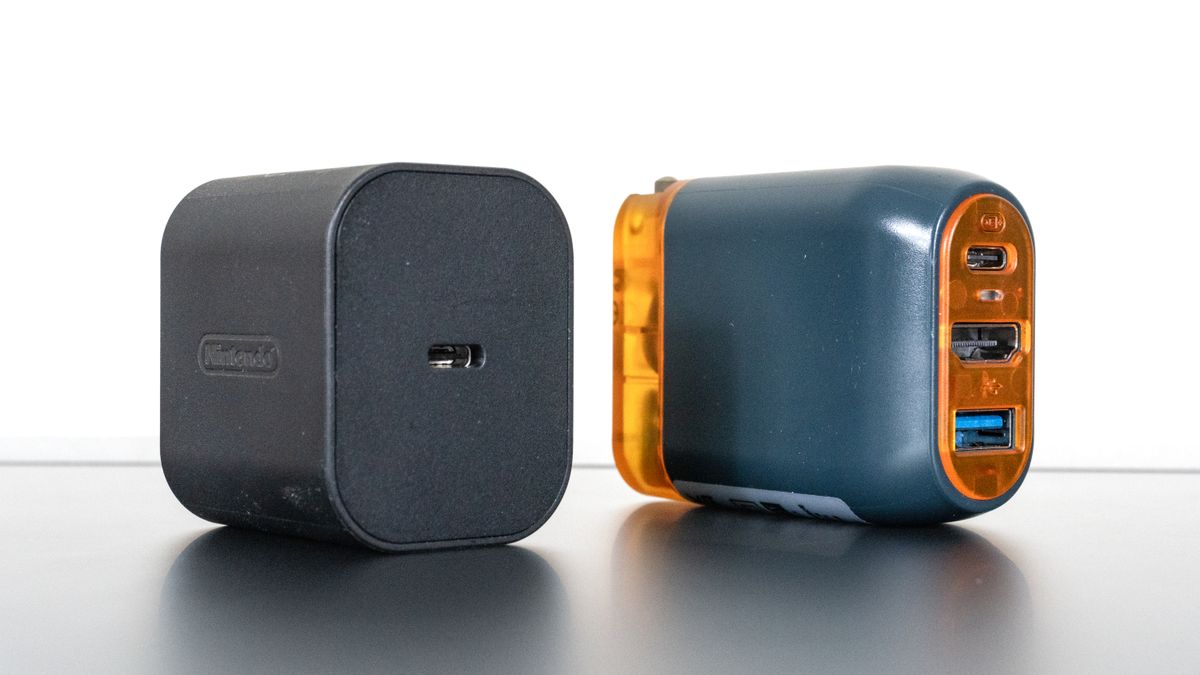 An official Nintendo Switch 2 power adapter next to the Genki Covert Dock 3