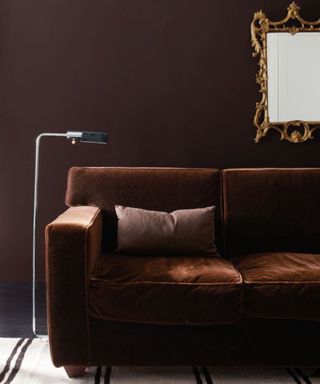 Brown couch with brown walls