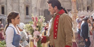 Gaston giving Belle flowers in Beauty and the Beast