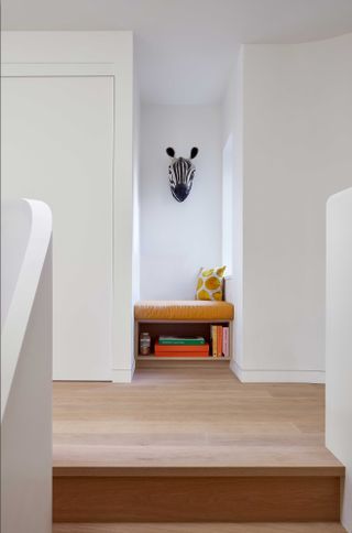 a reading nook at the top of the stairs