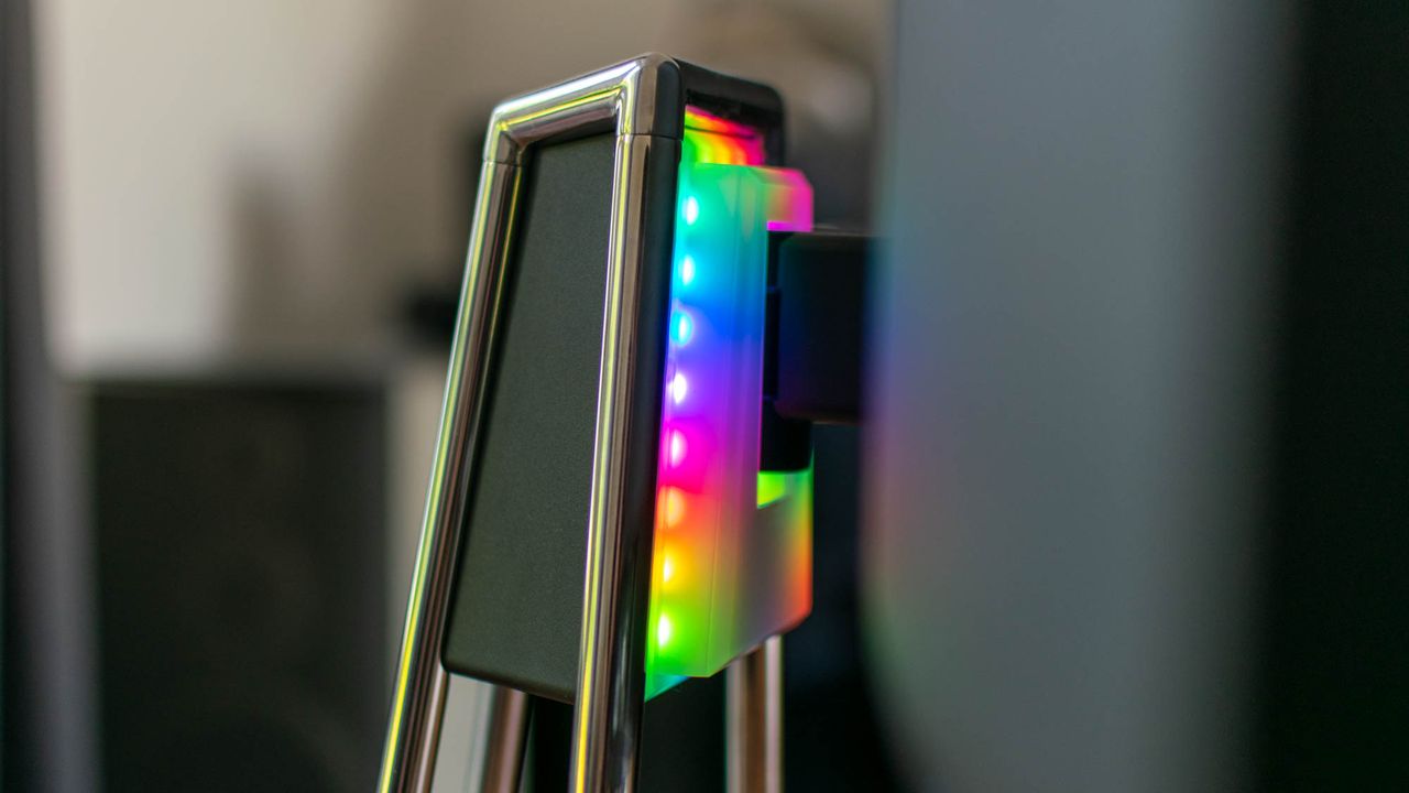 A closeup of the Porsche Design AOC Agon PD27 stand's RGB lighting