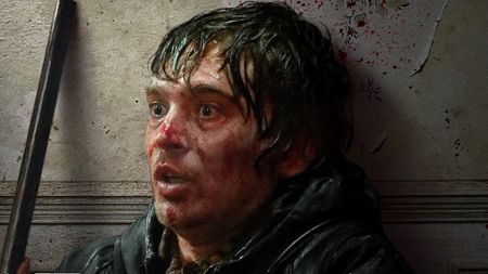 Bryan with bloodied face and wide eyes in Resident Evil (2026)