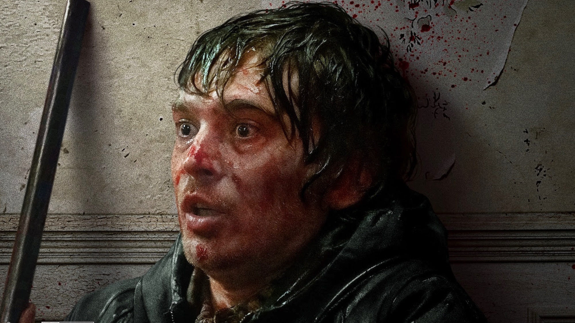 Bryan with bloodied face and wide eyes in Resident Evil (2026)