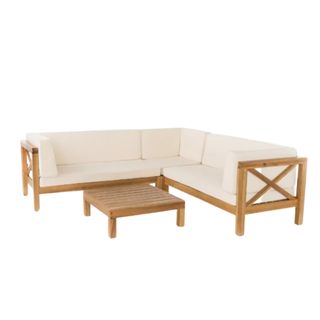 An outdoor corner sofa with white cushions and a table