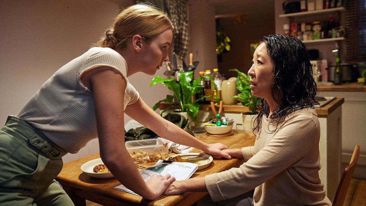 Villanelle holds onto Eve&#039;s right hand after dinner in Killing Eve