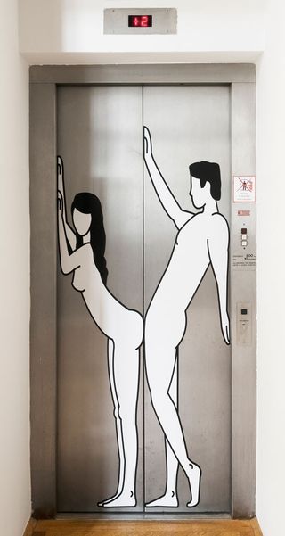 A lift with a woman on one door and a man on the other, designed to join when the doors are closed