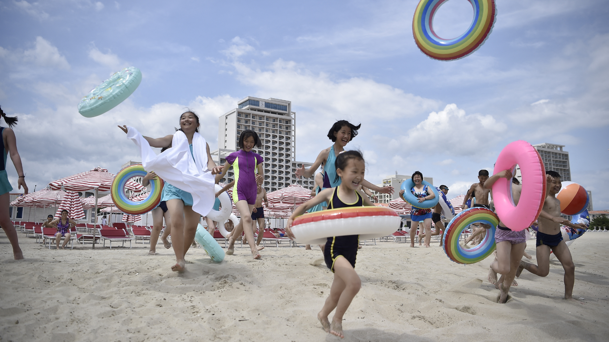 Domestic tourists visit the beach at Wonsan Kalma Coastal Tourist Area in North Korea's Kangwon Province on July 1, 2025
