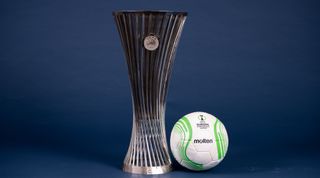 A view of the UEFA Europa Conference League 2022/23 Group Stage match ball next to the UEFA Europa Conference League trophy during the UEFA Club Competitions 2022/23 Match Balls Shoot at the UEFA Headquarters, The House of the European Football, on August 3, 2022, in Nyon, Switzerland.