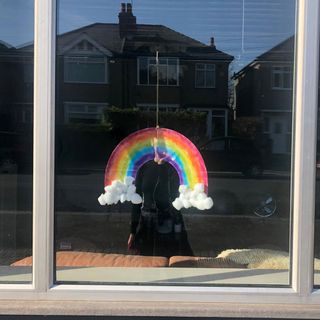 white glass window with rainbow