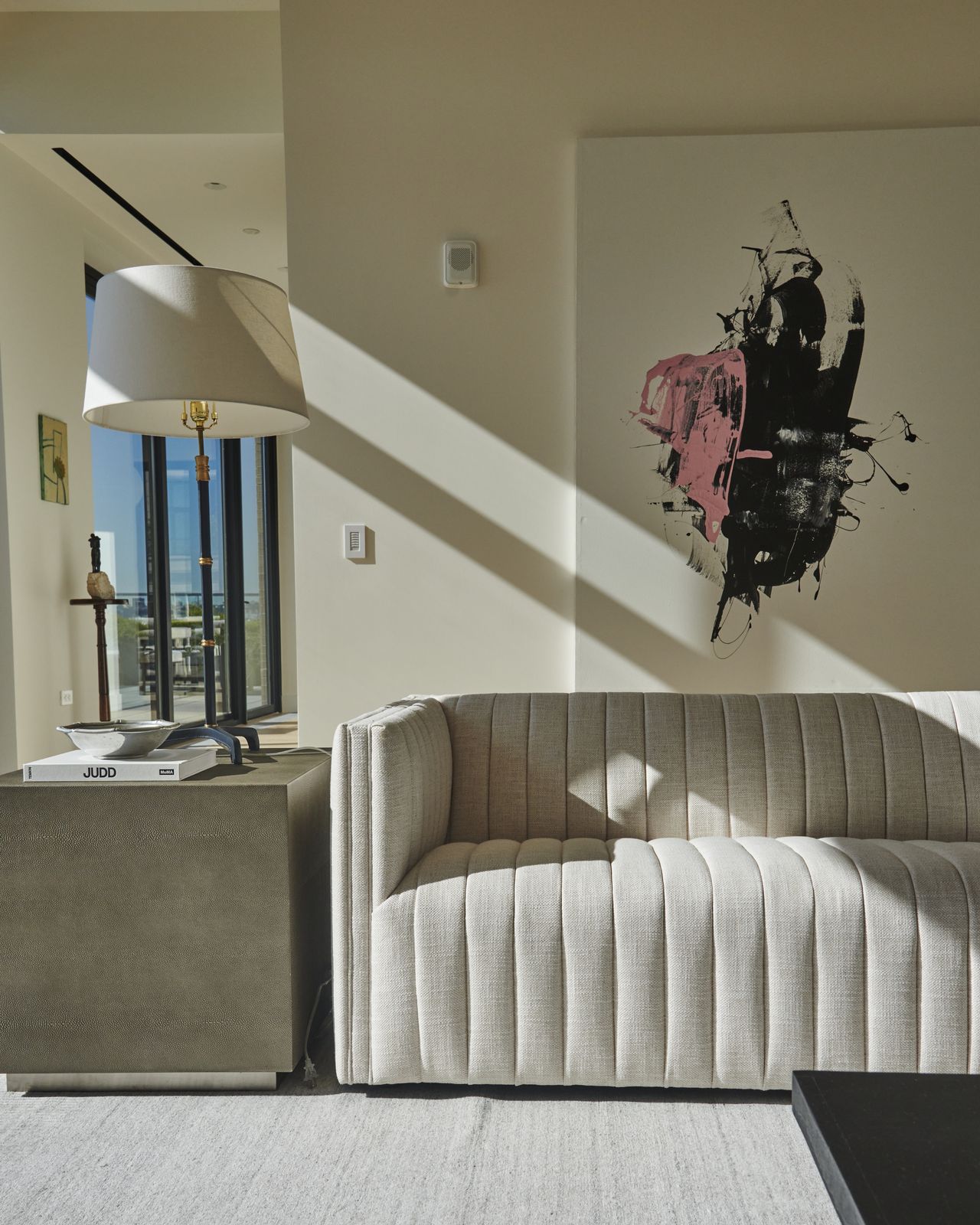 A living room with ribbed sofa