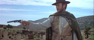 Blondie (Clint Eastwood) draws his pistol in the three-way duel in
