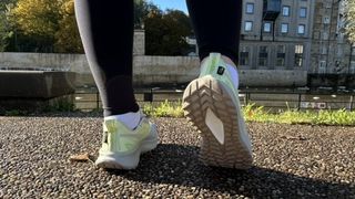 Woman's feet wearing Reebok Floatride Energy 5 Adventure shoes - rear view showing sole