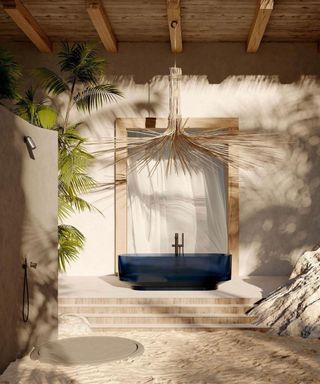 Outdoor bathroom with a bathtub and shower