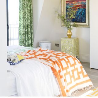 bedroom with white wall and green curtain