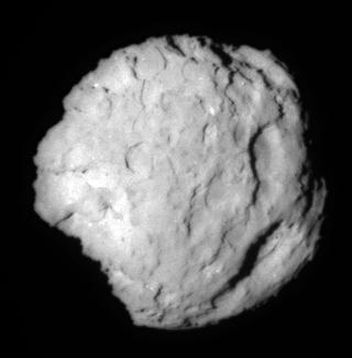 A view of the comet in greyscale against a dark background.