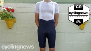 Front-on image of Writer wearing Rapha Core Cargo bib shorts, image overlaid with recommends badge