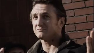 Sean Penn in front of a brick wall in Mystic River