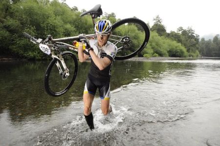 Stefan Sahm (Germany) leads the race across a ford.