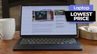 Lenovo IdeaPad Duet 5 Chromebook on a coffee table with the display open showing LaptopMag.com and a lowest price banner is overlaid on the image