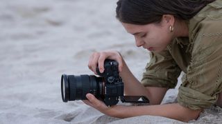 A photographer using the Sony 28-70mm f/3.5-5.6 OSS II