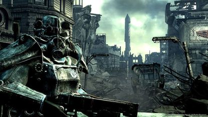 Fallout 3 screenshot of someone in power armor standing in front of a rundown version of the Washington Monument
