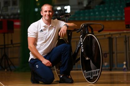 Jason Kenny posing with his Hope Lotus bike before the Tokyo 2020 Olympic Games