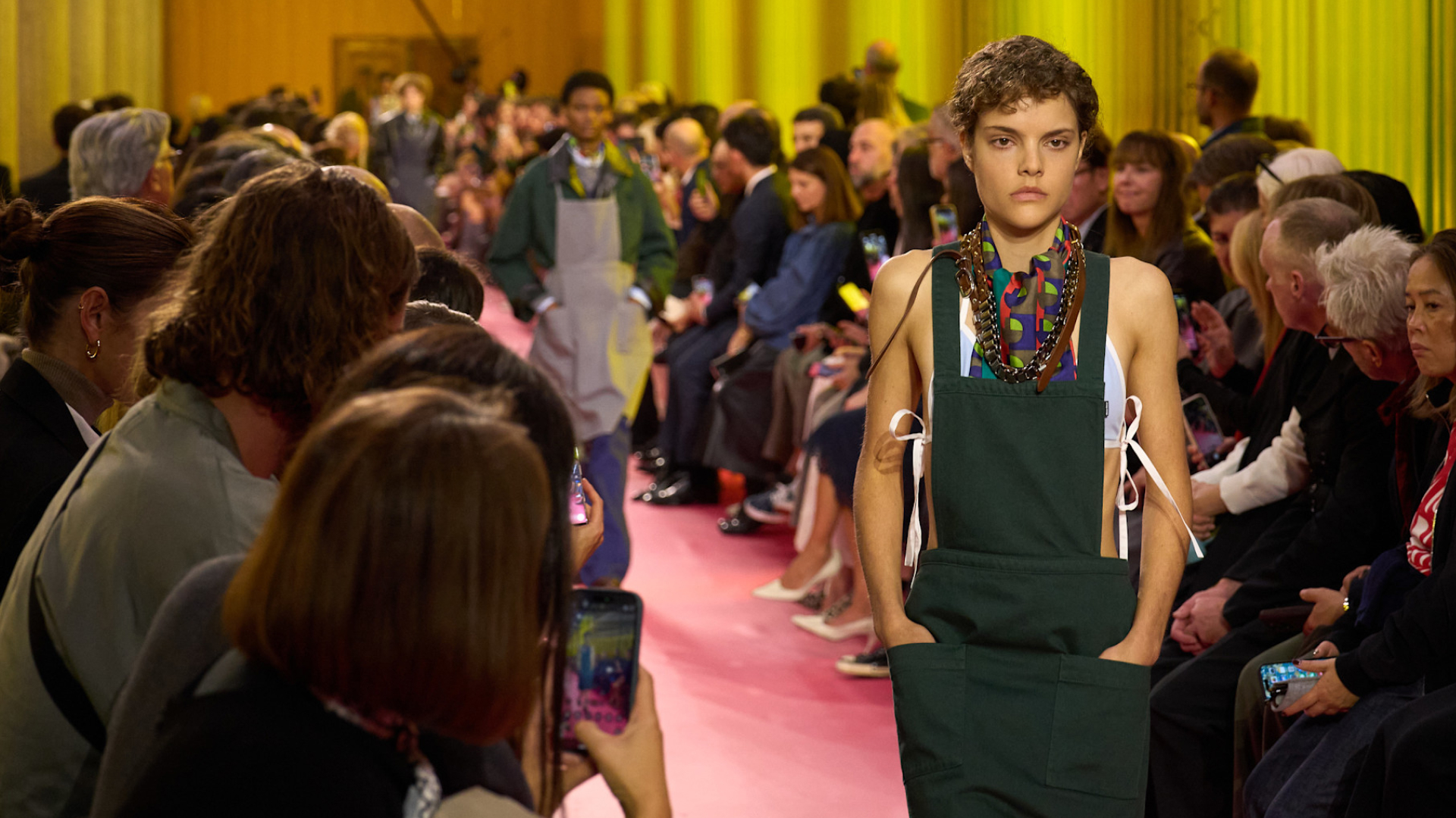 a model on the Miu Miu Spring 2026 runway wearing an apron