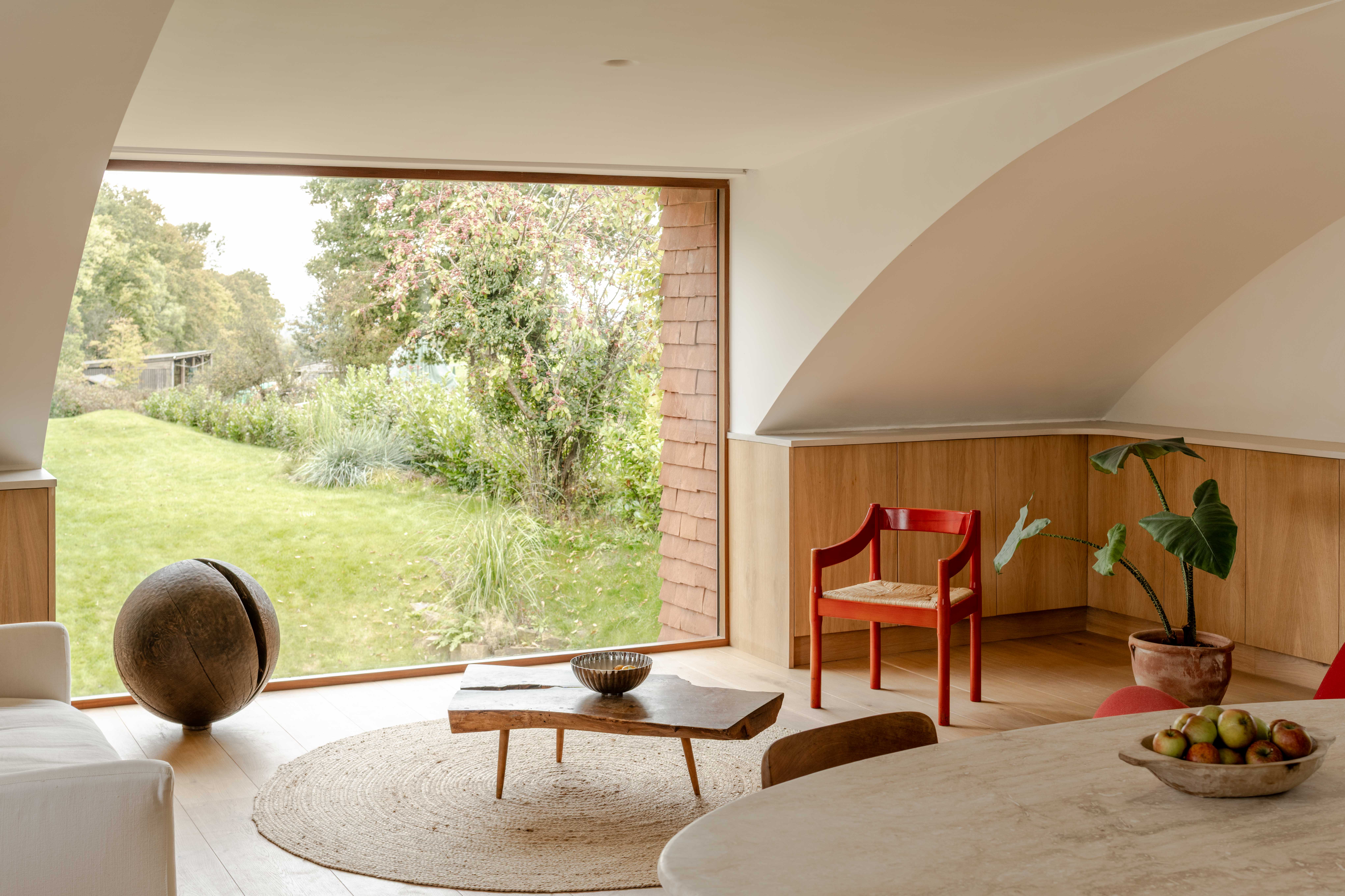 image of Clay Rise by Templeton Ford, a brick house with a curved roof in west sussex countryside