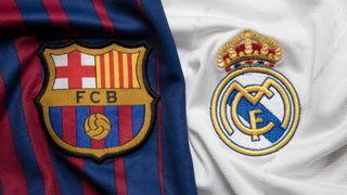 The logos of Barcelona and Real Madrid on football shirts