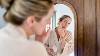 Woman cleaning her face