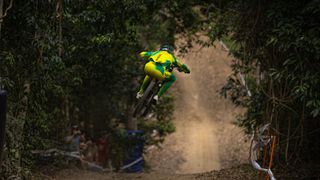 Troy Brosnan in australian colors racing downhill mountain bike at Crankworx 2022