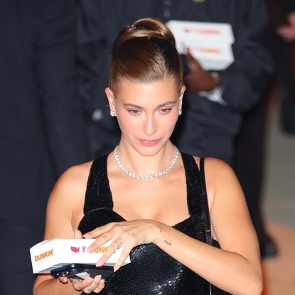 Hailey Bieber wears a vintage Bob Mackie dress and Saint Laurent pumps to attend Kris Jenner's 70th birthday party