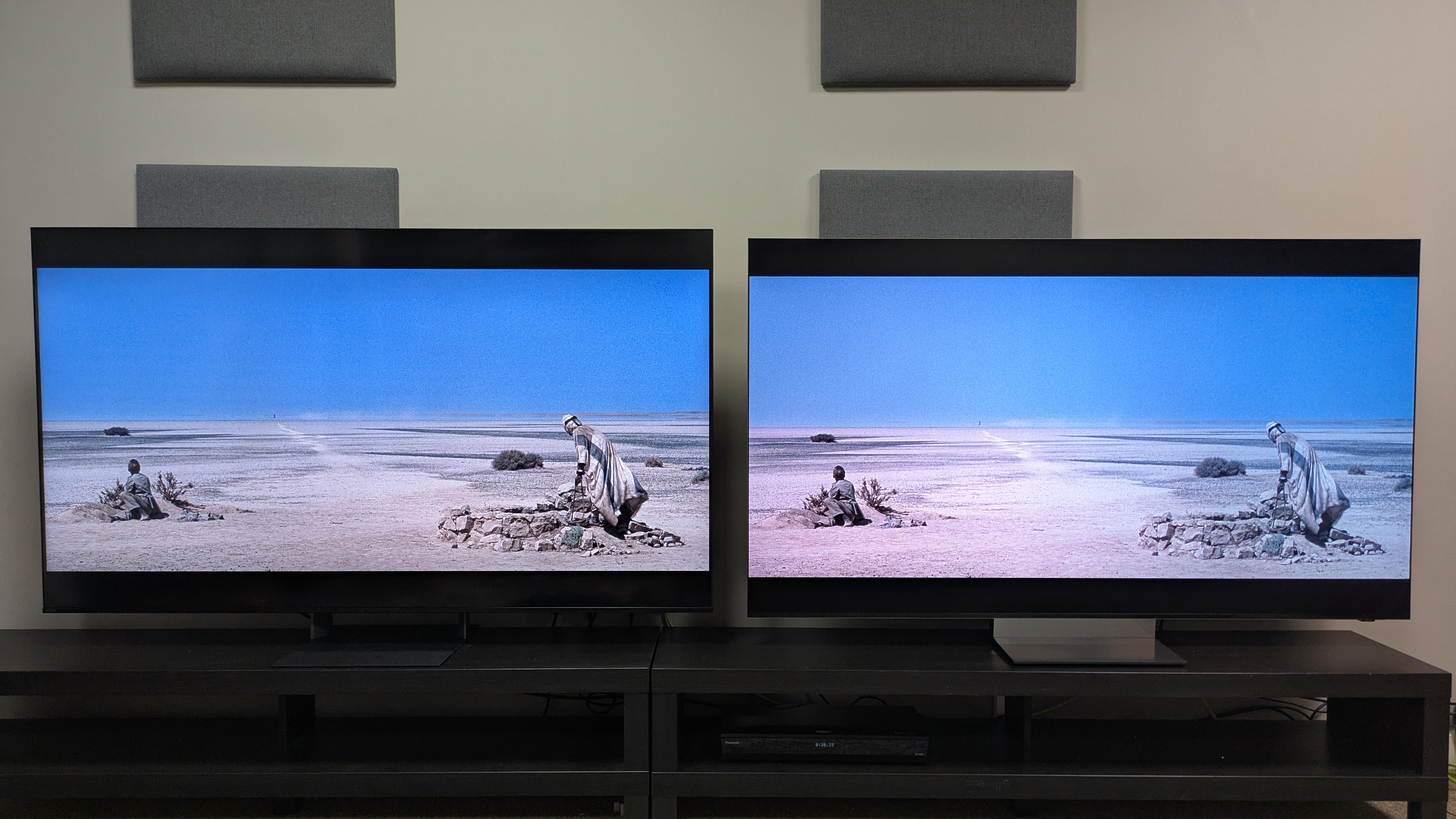 Sony Bravia 7 II (left) vs Samsung R95H (right) showing a desert scene from Lawrence of Arabia. The R95H has punchier brightness than the Bravia 7 II, shown in the white sands