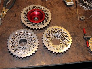 Three stages of a SRAM cassette. The completed version at top slides onto the hub drive ring