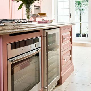 kitchen with pink cabinets microwave stove