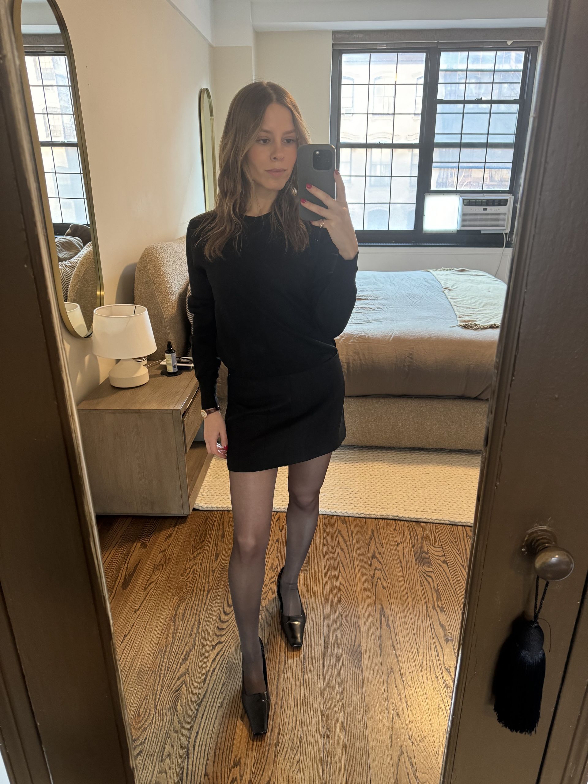 Nikki wears the amazon anrabess sweater in black.