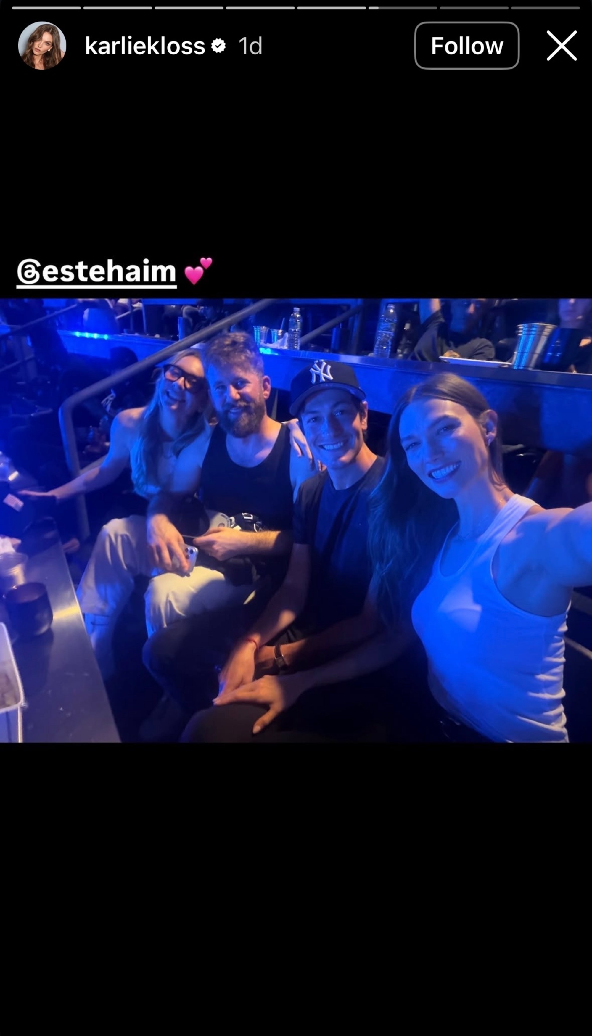 Este Haim and Karlie Kloss posing for a selfie with their husbands.